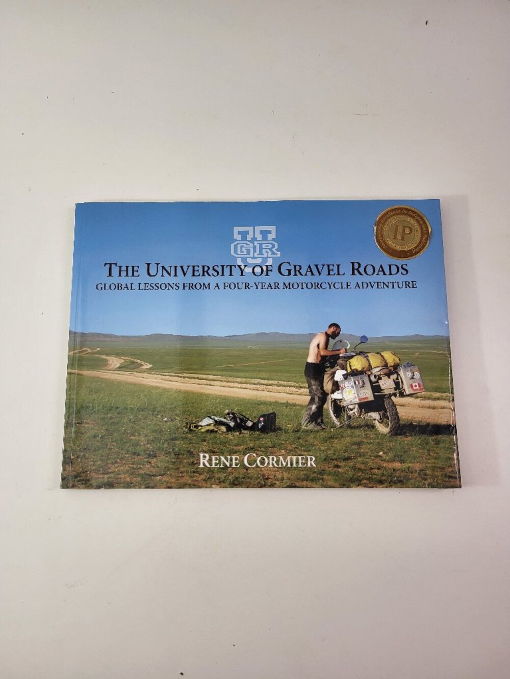 The University of Gravel Roads Rene Cormier SIGNED Motorcycle Adventure Book